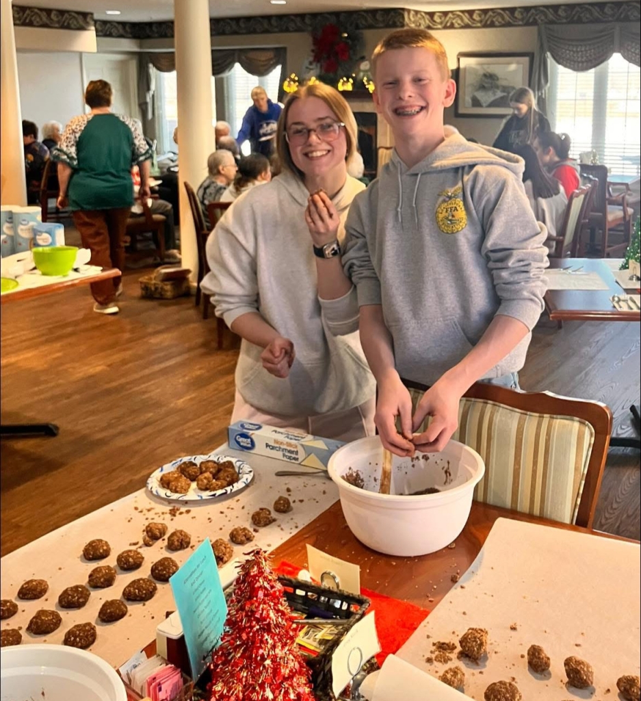 Lebanon FFA Chapter Sentinel Garrett Adams and Secretary Addison Hand prepare the no-bake cookies.