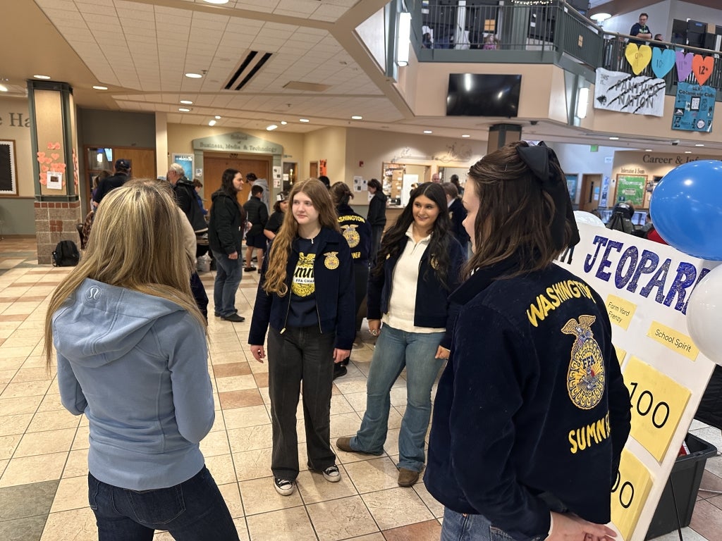 Sumner FFA members explain the importance of agriculture to their school district superintendent, Dr. Laurie Dent.