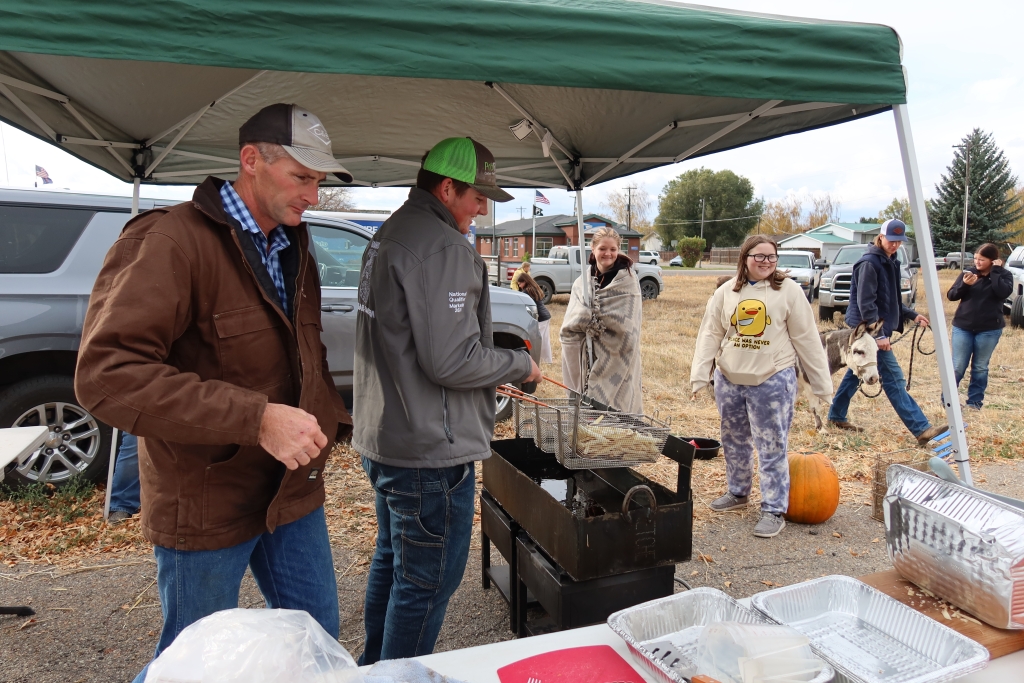 Alumni member Dwight Little makes fries for the fundraiser.