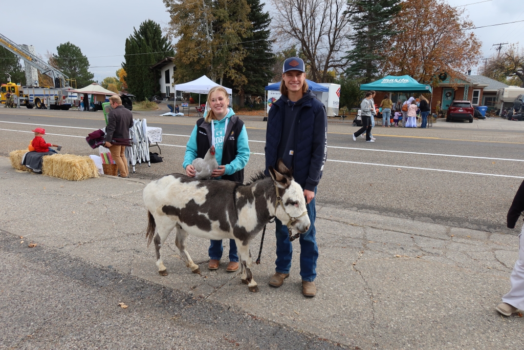 Sarah Jones and Dillan Lerwill pose with their animals at “Treats on the Streets” event.