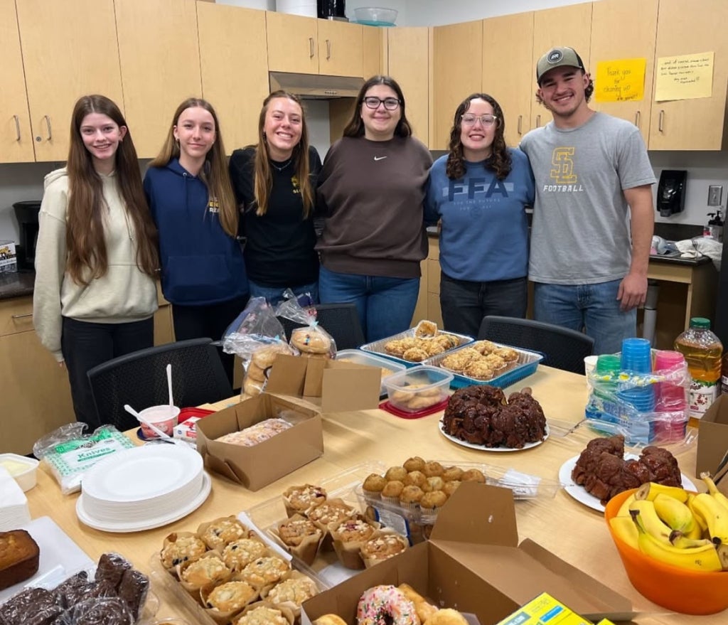 San Luis Obispo FFA members behind their teacher appreciation breakfast spread.