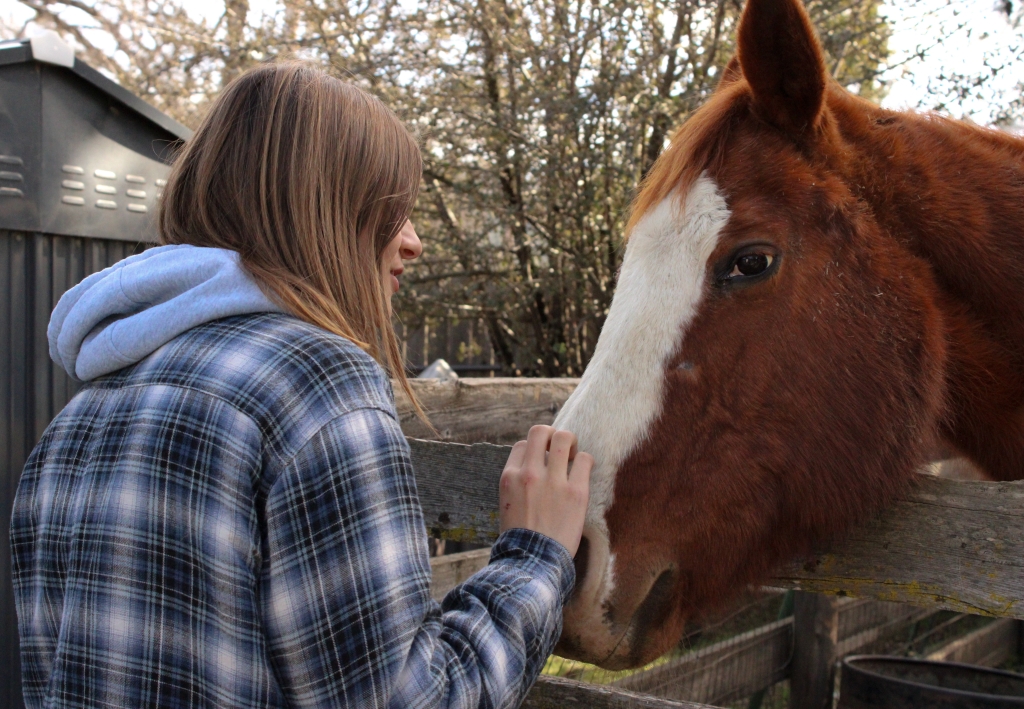 Allie Johanson bonds with a horse.