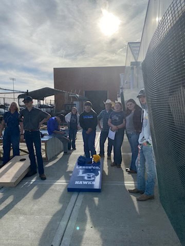 The after-school corn hole crew.