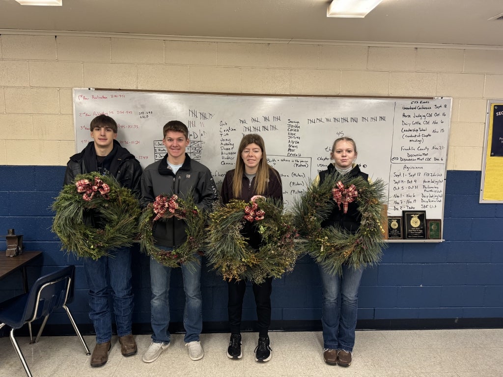 Gage Peine, Stetson Miller, Hannah Matile and Paige Powell with their finished creations.