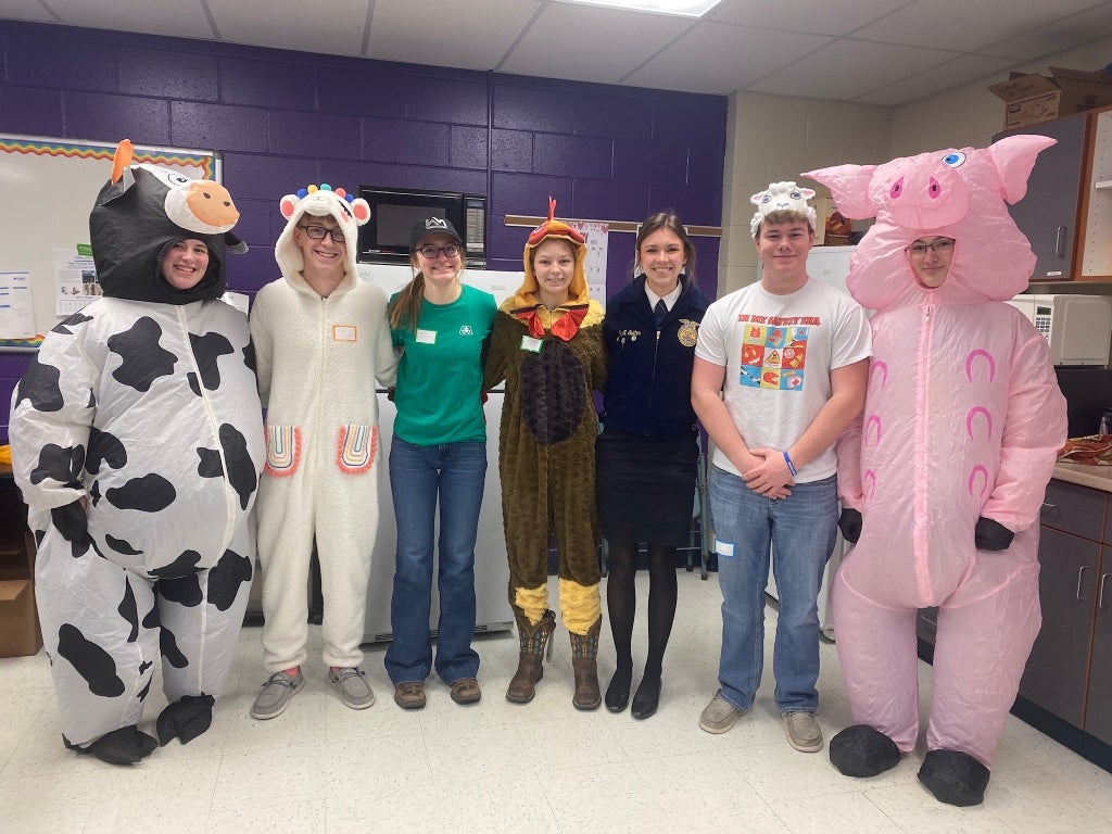 Members of the DeWitt Central FFA officer team pose in their costumes before reading to elementary students.