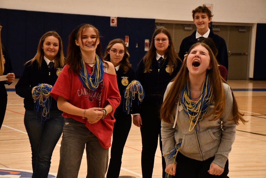 A student reacts to winning the school-wide rock, paper, scissors tournament.