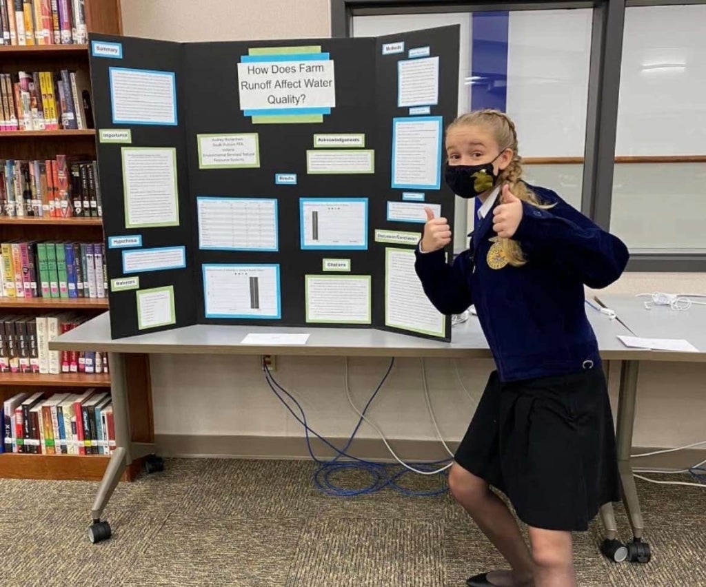 Richardson with her first Agriscience Fair research project, which focused on how farm runoff impacts water quality.