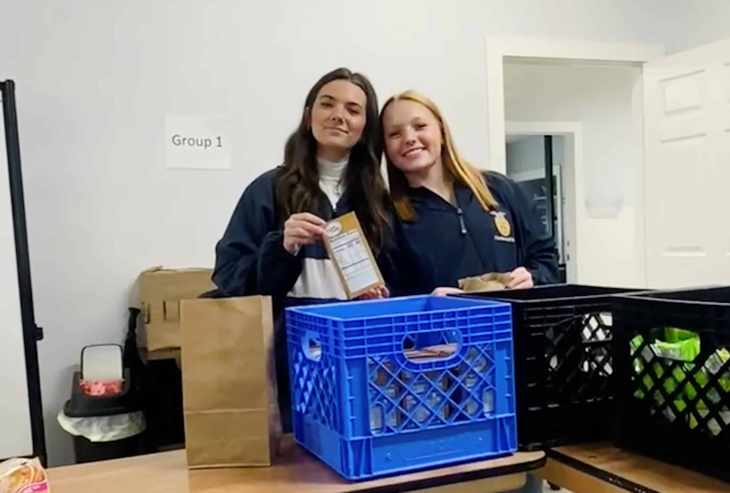 Members of Friendswood FFA pack bags of nonperishable food for Dickinson ISD students.